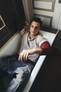 a man is laying in a bathtub